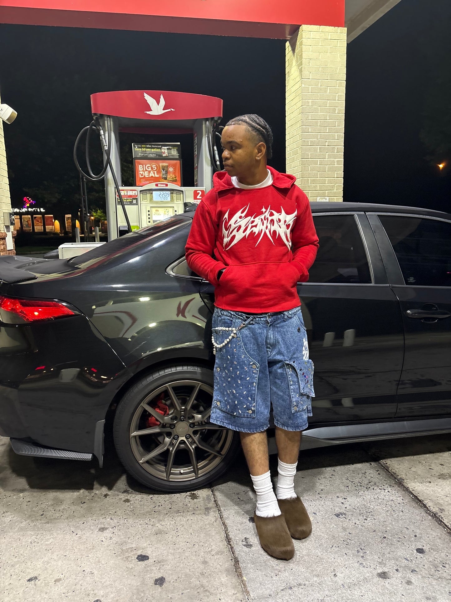 Red “¡SAINT!” hoodie