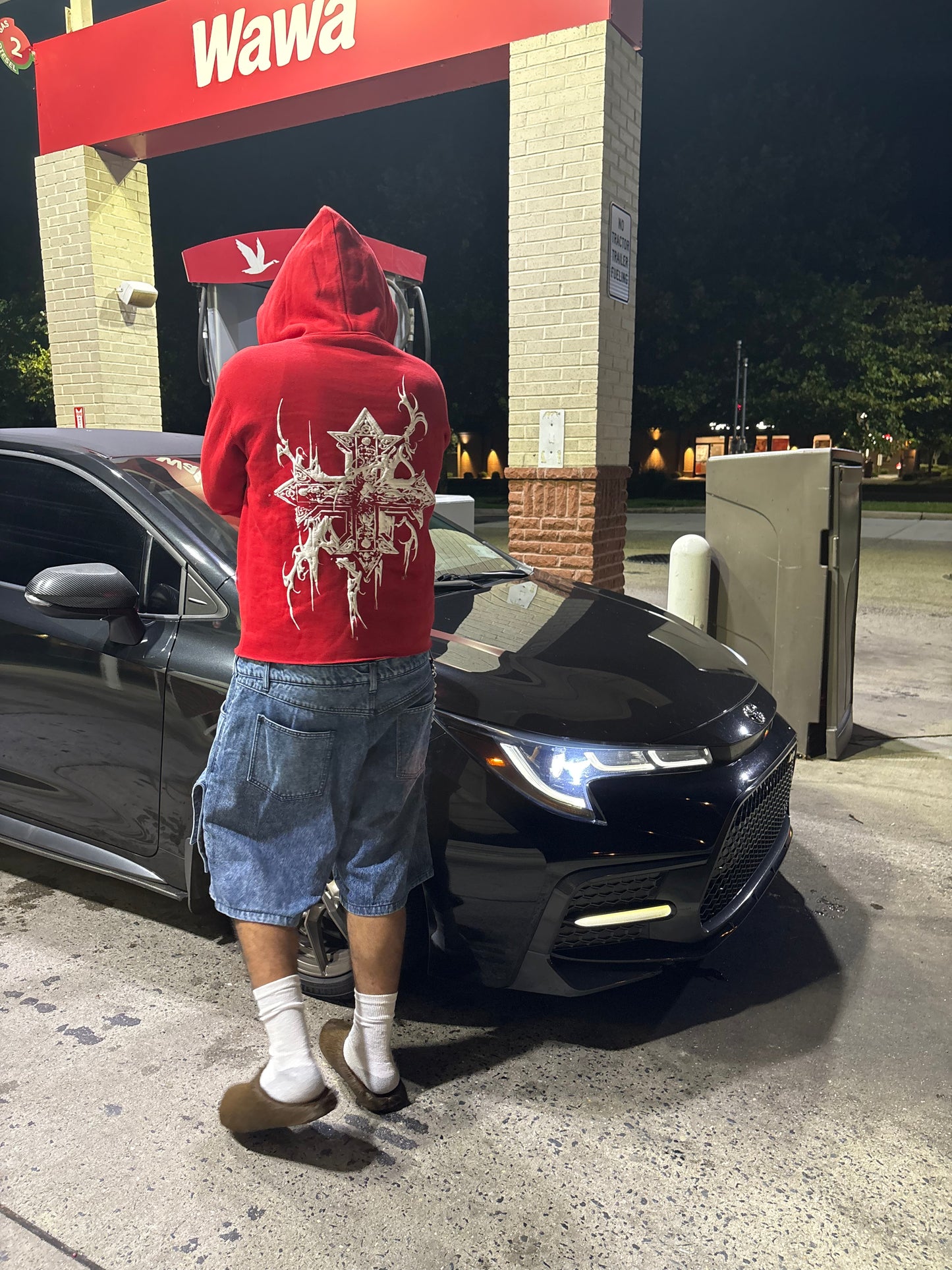 Red “¡SAINT!” hoodie